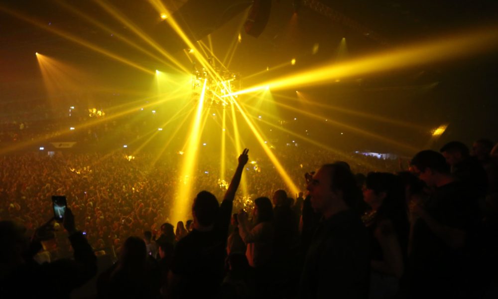 Spotlights over a crowded space at a managed event